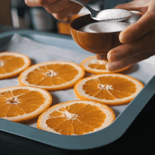 Adding Sugar On Top Of Sliced Orange Two Plaid Aprons GIF
