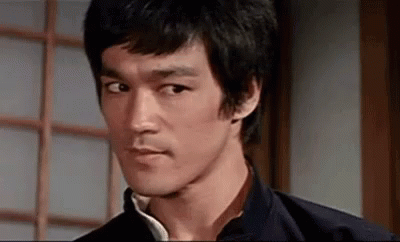 Bruce Lee Smirk GIF