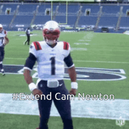 Football player in white jersey number one crosses arms then lowers them on field.