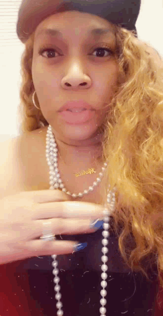 Caramella Clutches Pearls GIF