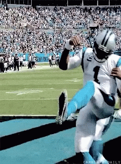 Football player fumbles ball during tackle, opponent recovers it.