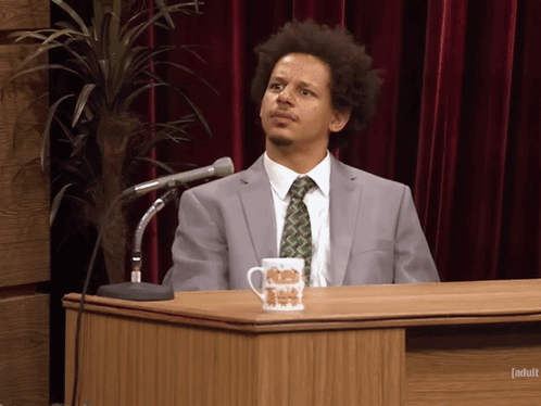 Eric Andre Shrug GIF