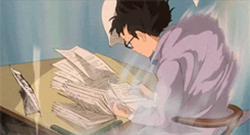 Person in purple robe studying at desk with papers flying around.