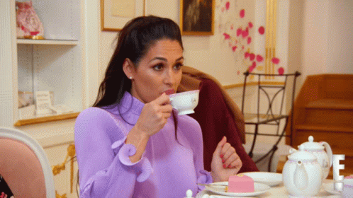 Girl Sips Tea GIF