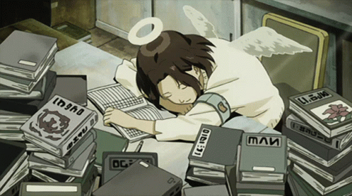 A young person with dark hair and a halo rests their head on a desk surrounded by books and papers.