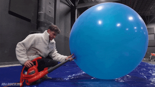 Inflating A Giant Balloon How Ridiculous GIF