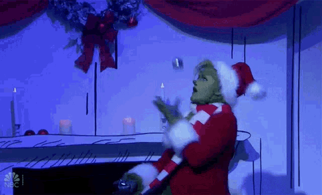 Juggle Grinch GIF