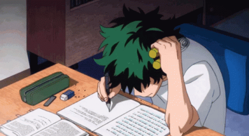 Person with green hair studying at a desk, head in hand, writing in notebook.