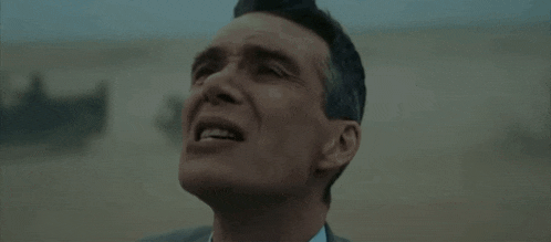 Oppenheimer Walking Through A Sandy Storm Oppenheimer Movie GIF