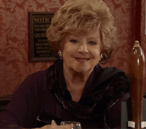 Rita Smiling And Drinking In The Rovers Coronation Street GIF