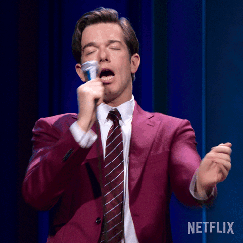 Shaking John Mulaney GIF