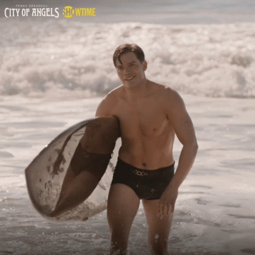 Smiling Dominic Sherwood GIF
