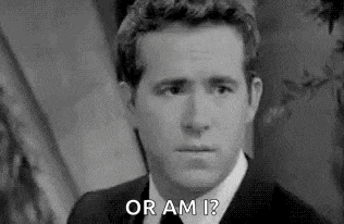 Smirk Ryan Reynolds GIF