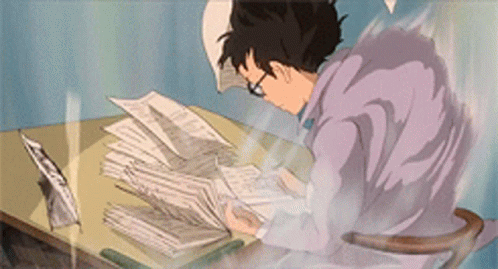 Person in purple robe studying at desk with papers blowing in wind.