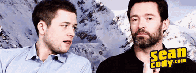 Taron Egerton Hugh Jackman GIF