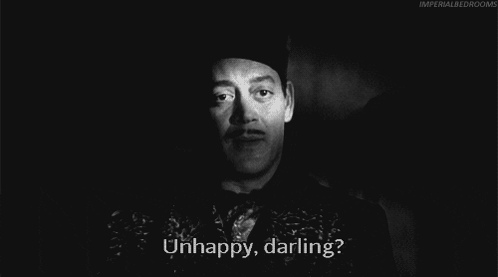 Unhappy Morticia Addams GIF