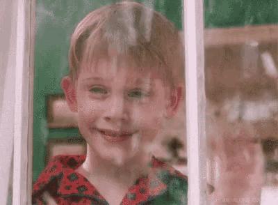 Waving Home Alone GIF