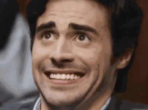 Awkward Smile GIF