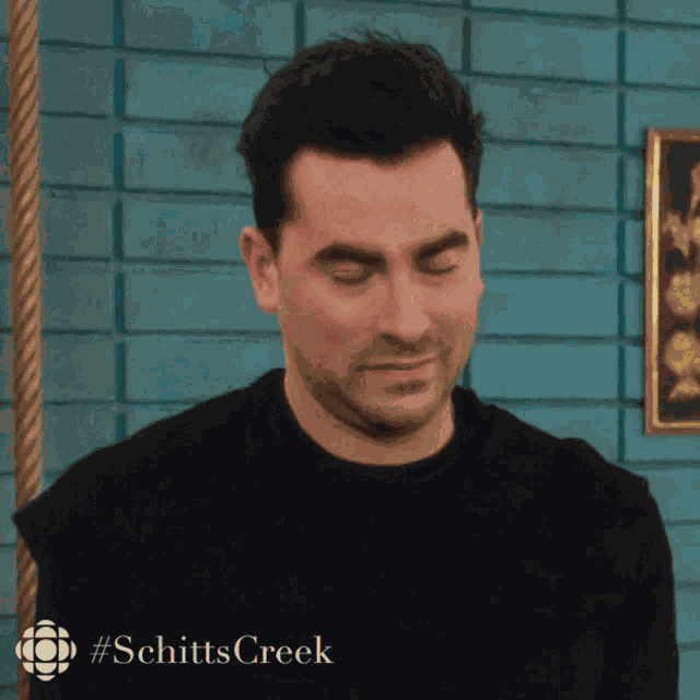 Bored Dan Levy GIF