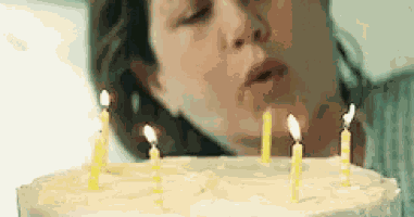 Girl Blowing Candles GIF