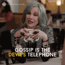 Gossiping Moira Rose GIF