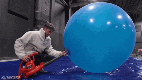 Inflating A Giant Balloon How Ridiculous GIF