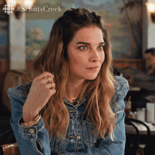 Intrigued Annie Murphy GIF