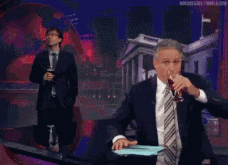 John Oliver And John Stewart Spit-take GIF