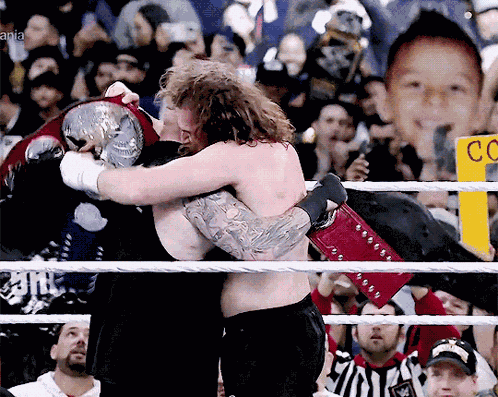 Kami Sami Zayn Kevin Owens Hug 2023 Wrestlemania 39 Raw And Smackdown Tag Titles GIF