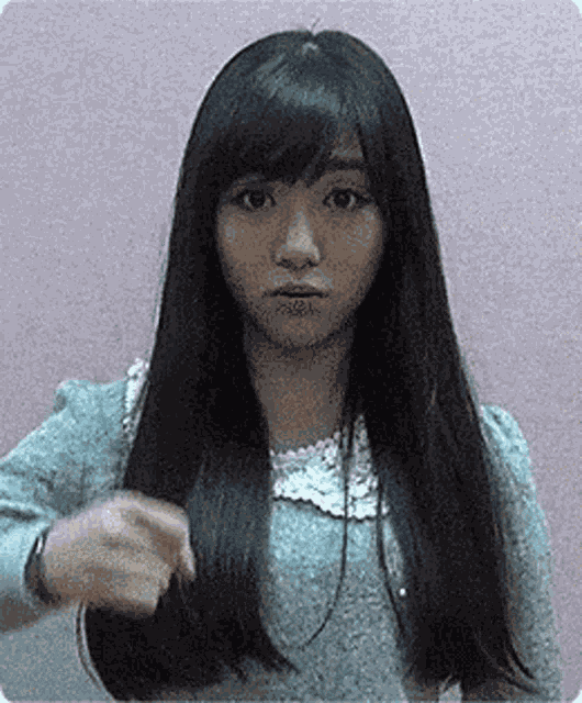 Mina Hand Gesture GIF