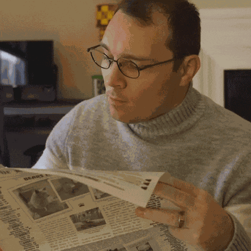 Reading A Newspaper Aj Pinkerton GIF