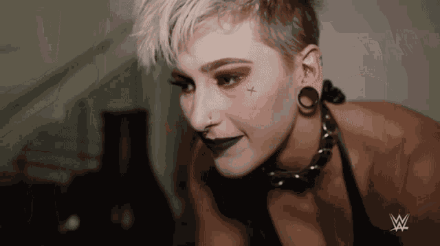 Rhea Ripley Scratches Head GIF