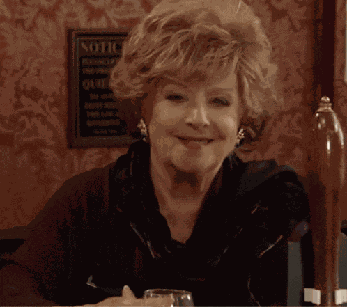 Rita Smiling And Drinking In The Rovers Coronation Street GIF