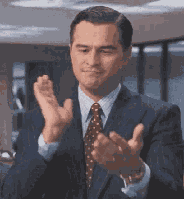 Roland Wolf Of Wall Street Clapping GIF