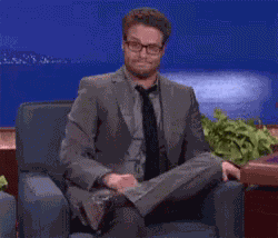 Seth Rogen Shrug & Grin GIF