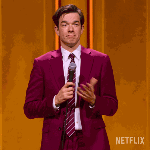 Shrug John Mulaney GIF