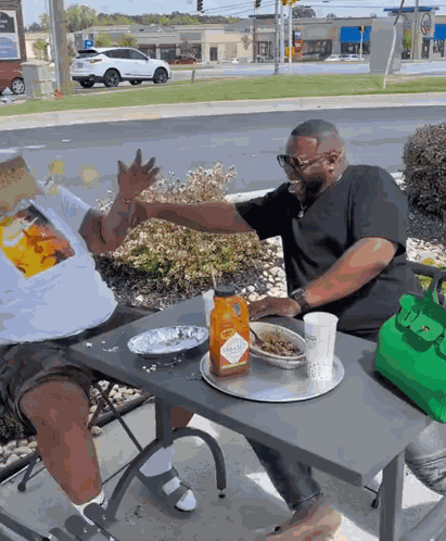Two People Laughing On Table GIF