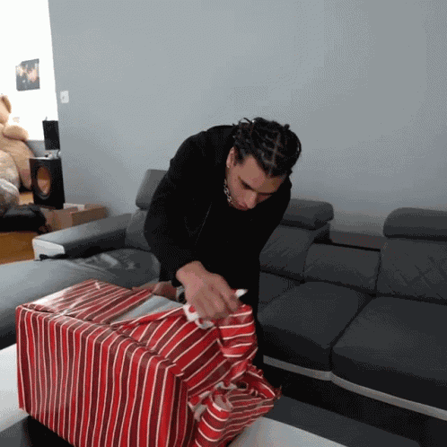 Unwrap The Gift Cyrus Dobre GIF